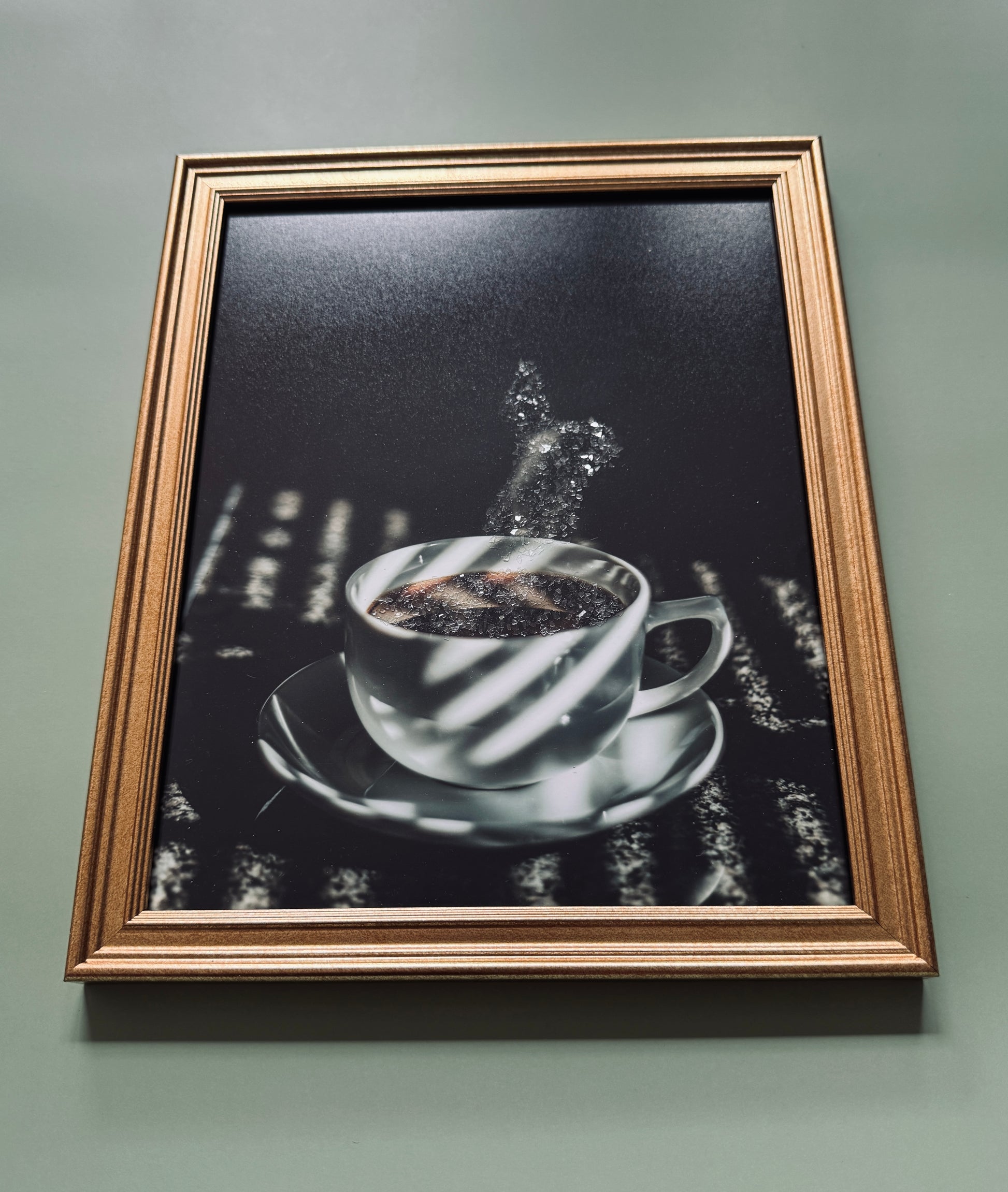 A photograph  of a steaming coffee cup embellished with glittered steam.