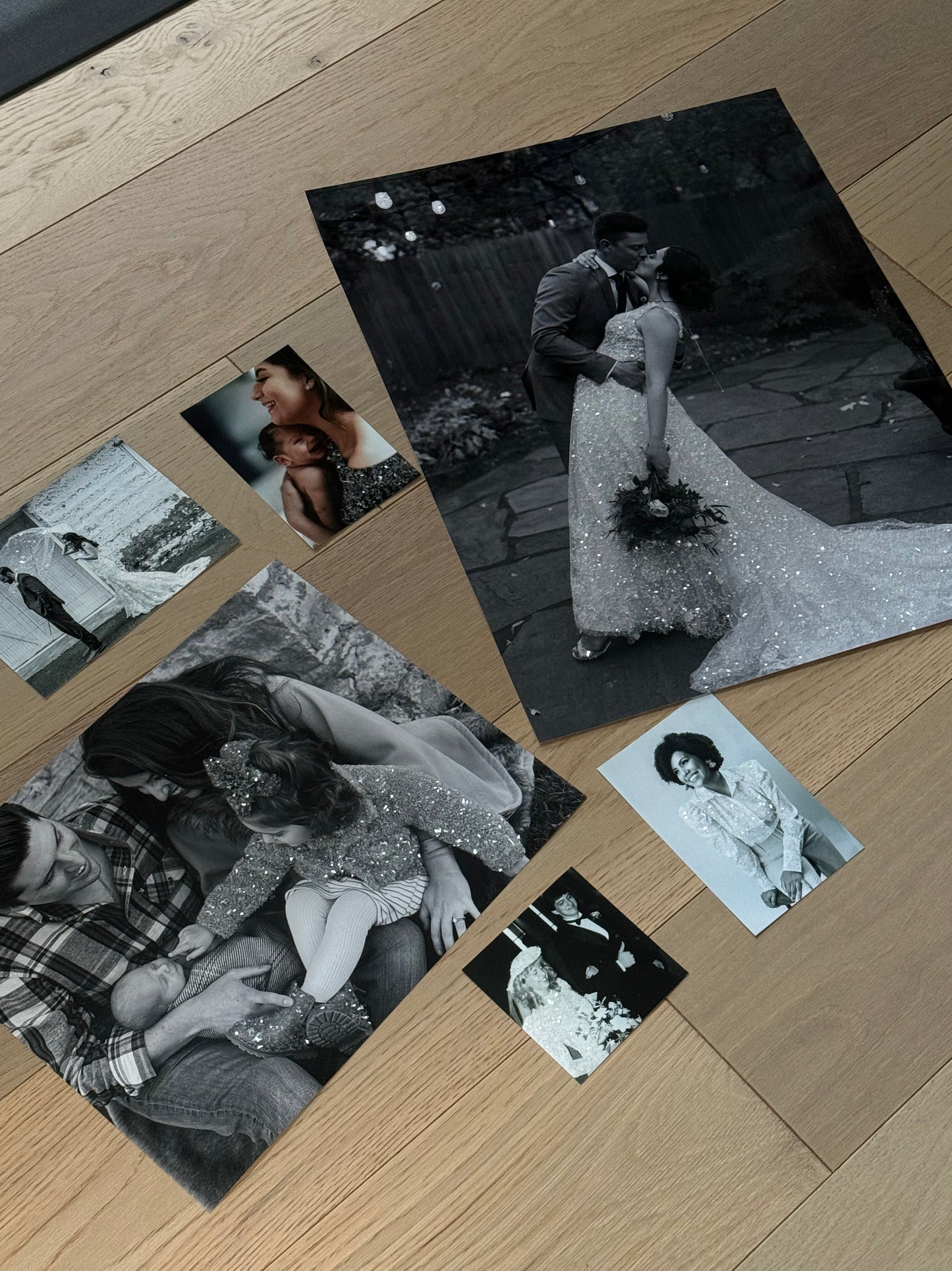 A view of several sparkle print samples in one viewing, brides, a baby, a professional woman and a family portrait sparkle prints included. 