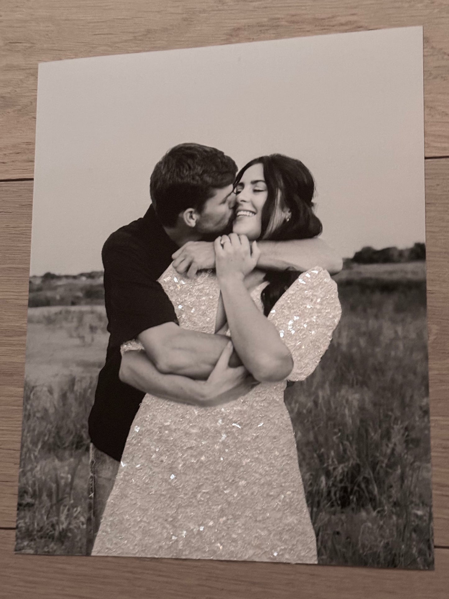 A Co. Lo Sparkle Print photograph sample of woman in white sparkled dress and fiance.