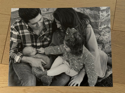 A sample of a family photo of a mother, father, toddler and baby, with sparkle embellished children's outfit.